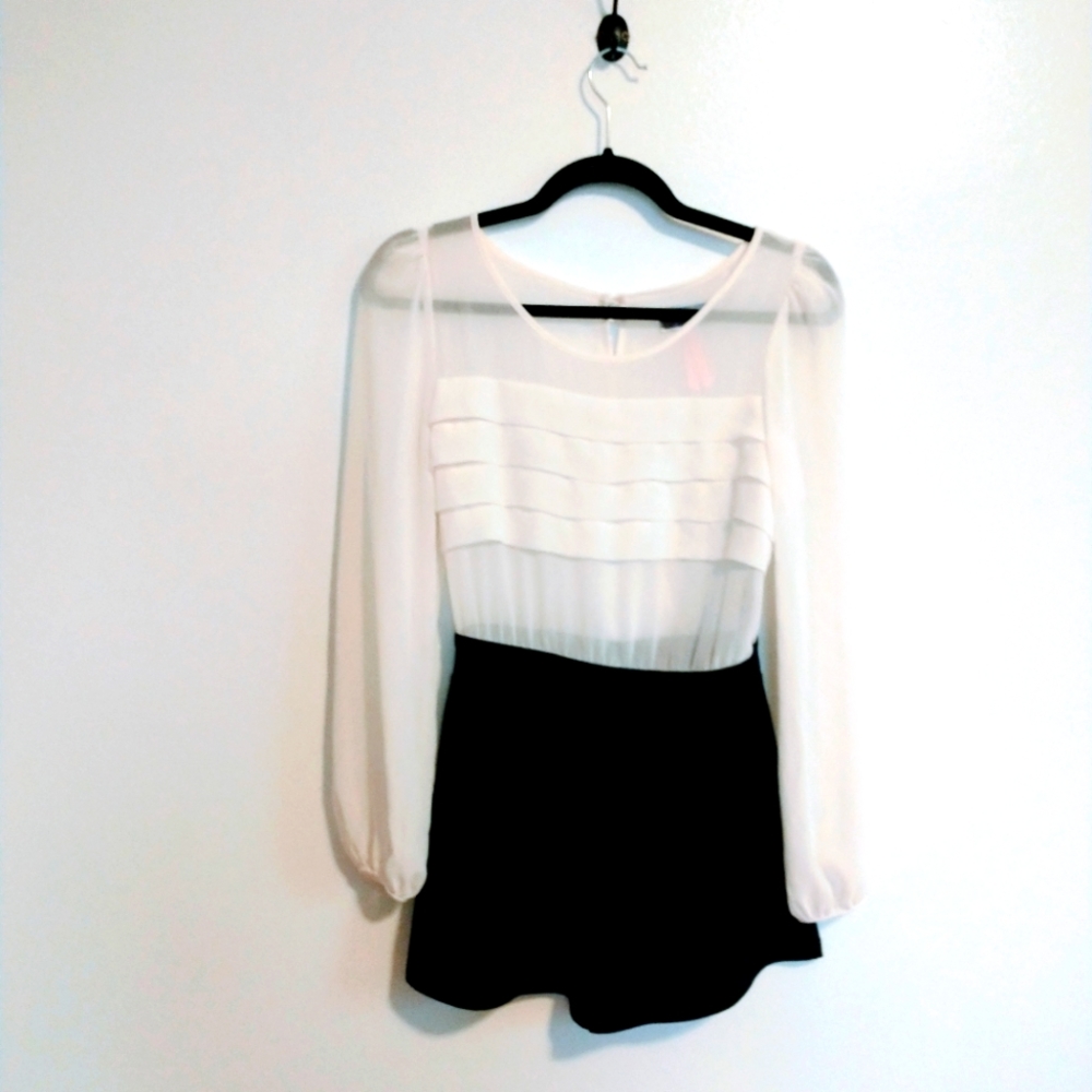 Long sleeve romper with ruffle front and pockets. Size 6, lipsy 2in1
